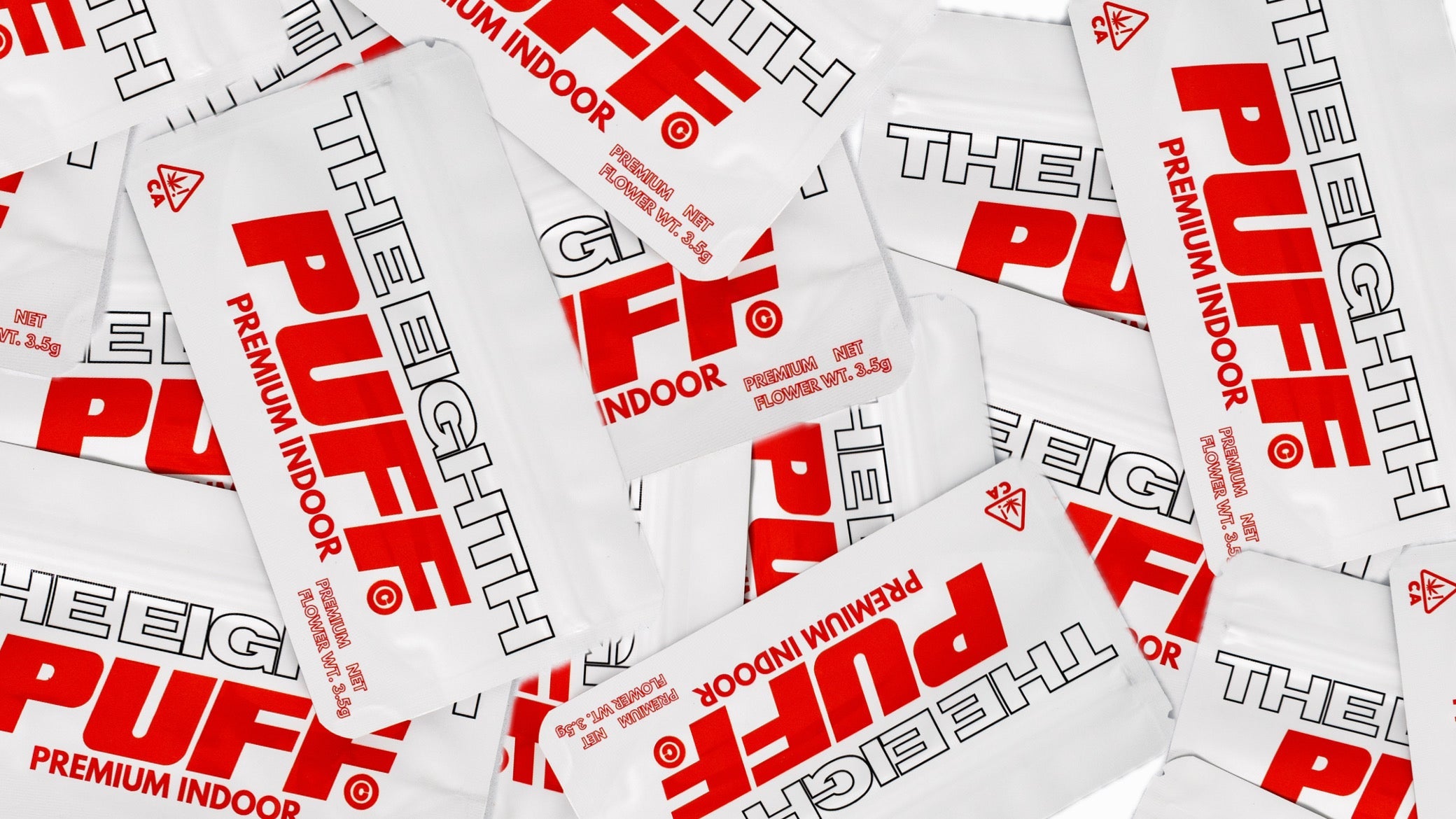 Multiple packages of 'The Eighth Puff' premium indoor cannabis product.